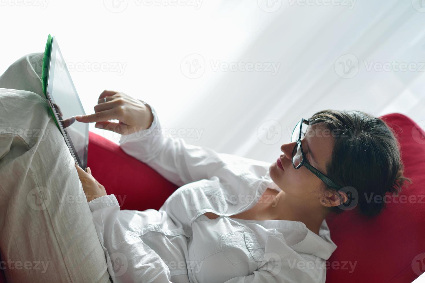 woman using tablet pc at home photo