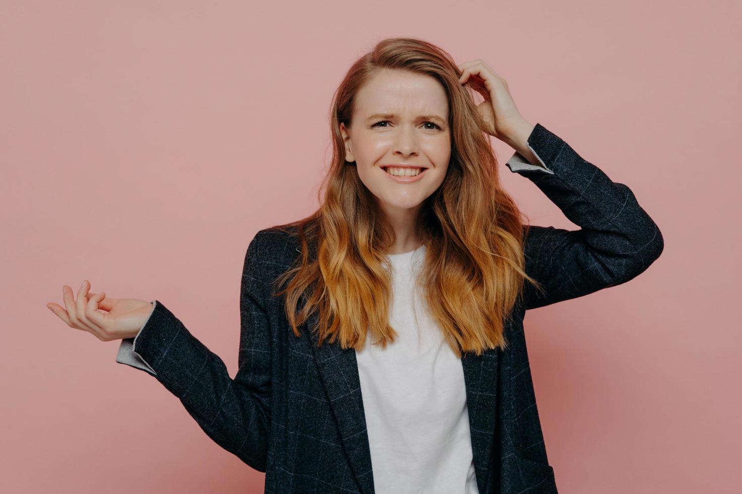 Smiling young woman can not believe what she hearing or seeing photo