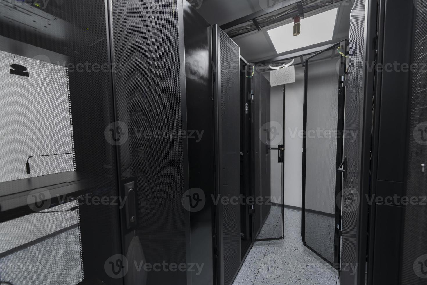 Data Center With Multiple Rows of Fully Operational Server Racks. Modern Telecommunications, Cloud Computing, Artificial Intelligence, Database, Supercomputer Technology Concept. photo