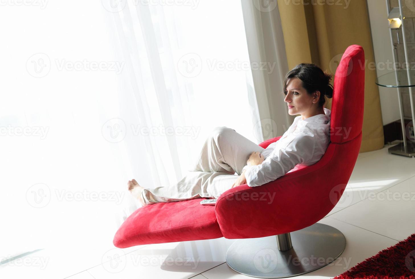 happy young woman relax at home on sofa photo