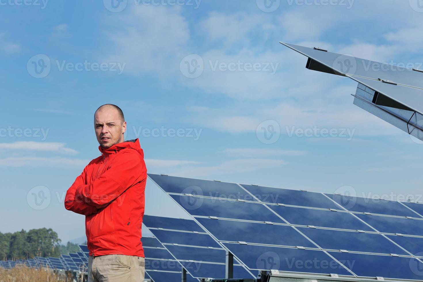 Male solar panel engineer at work place photo