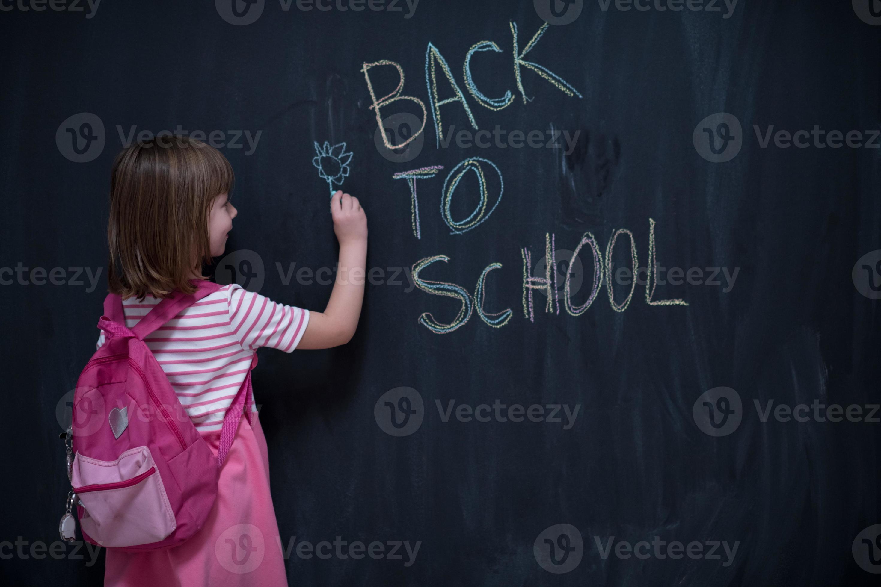school girl child with backpack writing chalkboard 11278704 Stock Photo