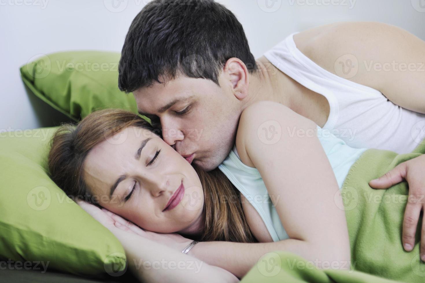 young couple in bed photo