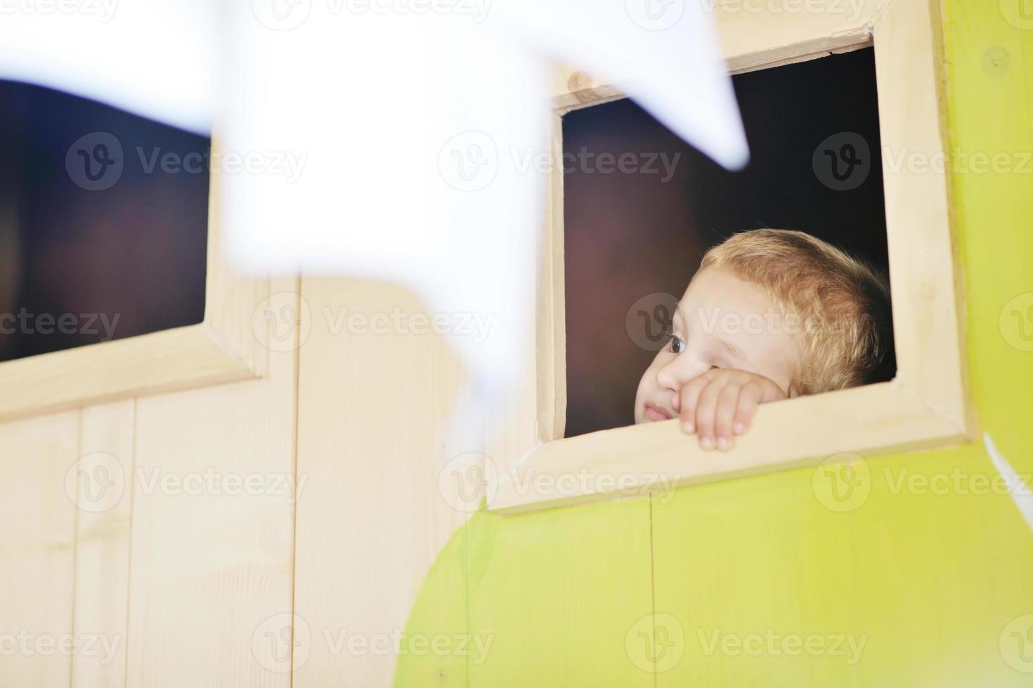 happy child in a window photo