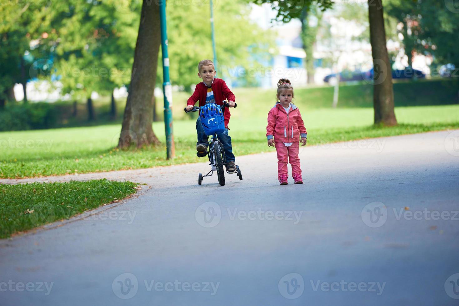 boy and girl with bicycle photo