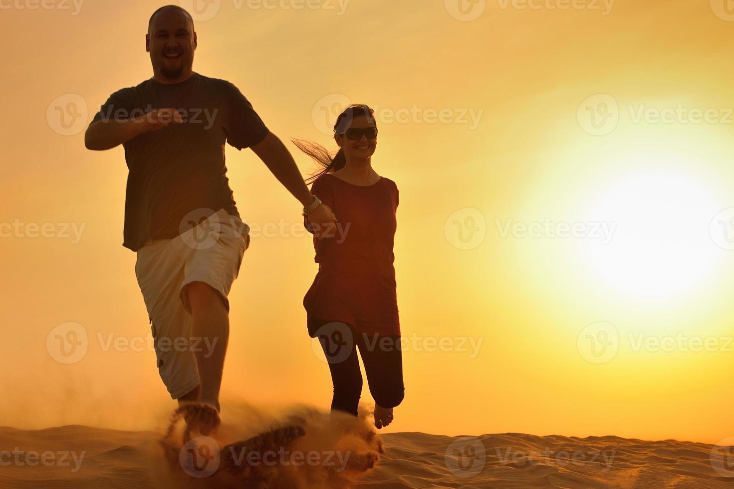 couple enjoying the sunset photo