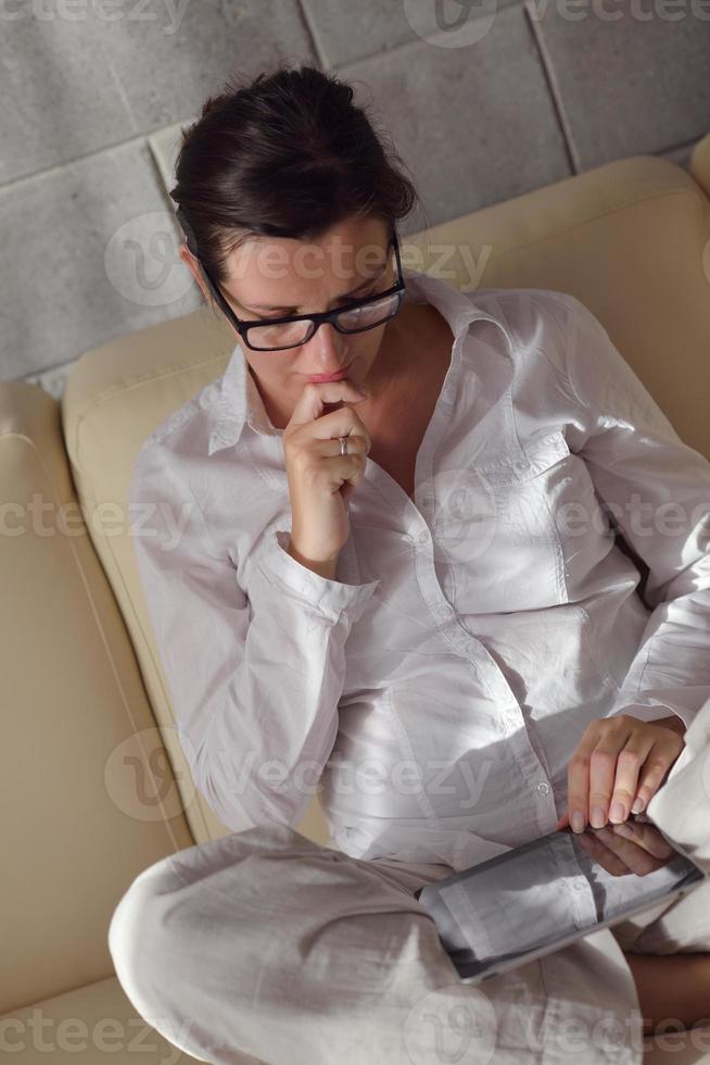 woman using tablet pc at home photo