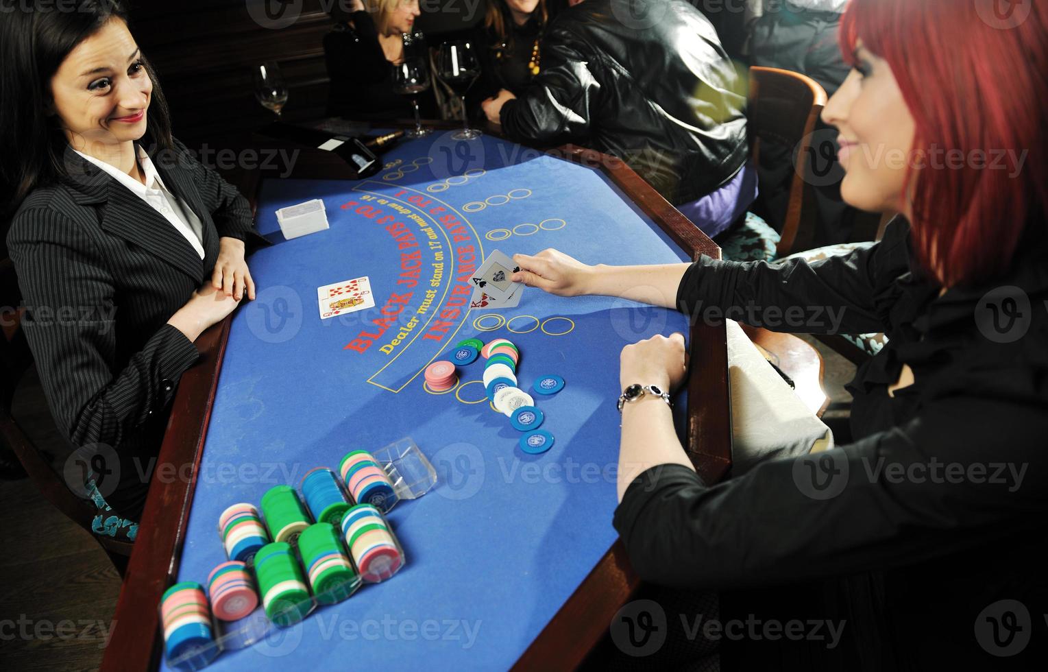 woman play black jack card game in casino photo