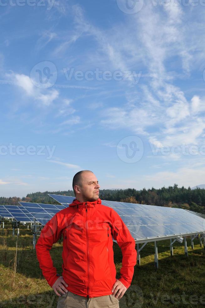 Male solar panel engineer at work place photo