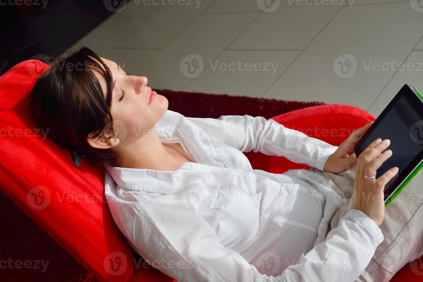woman using tablet pc at home photo