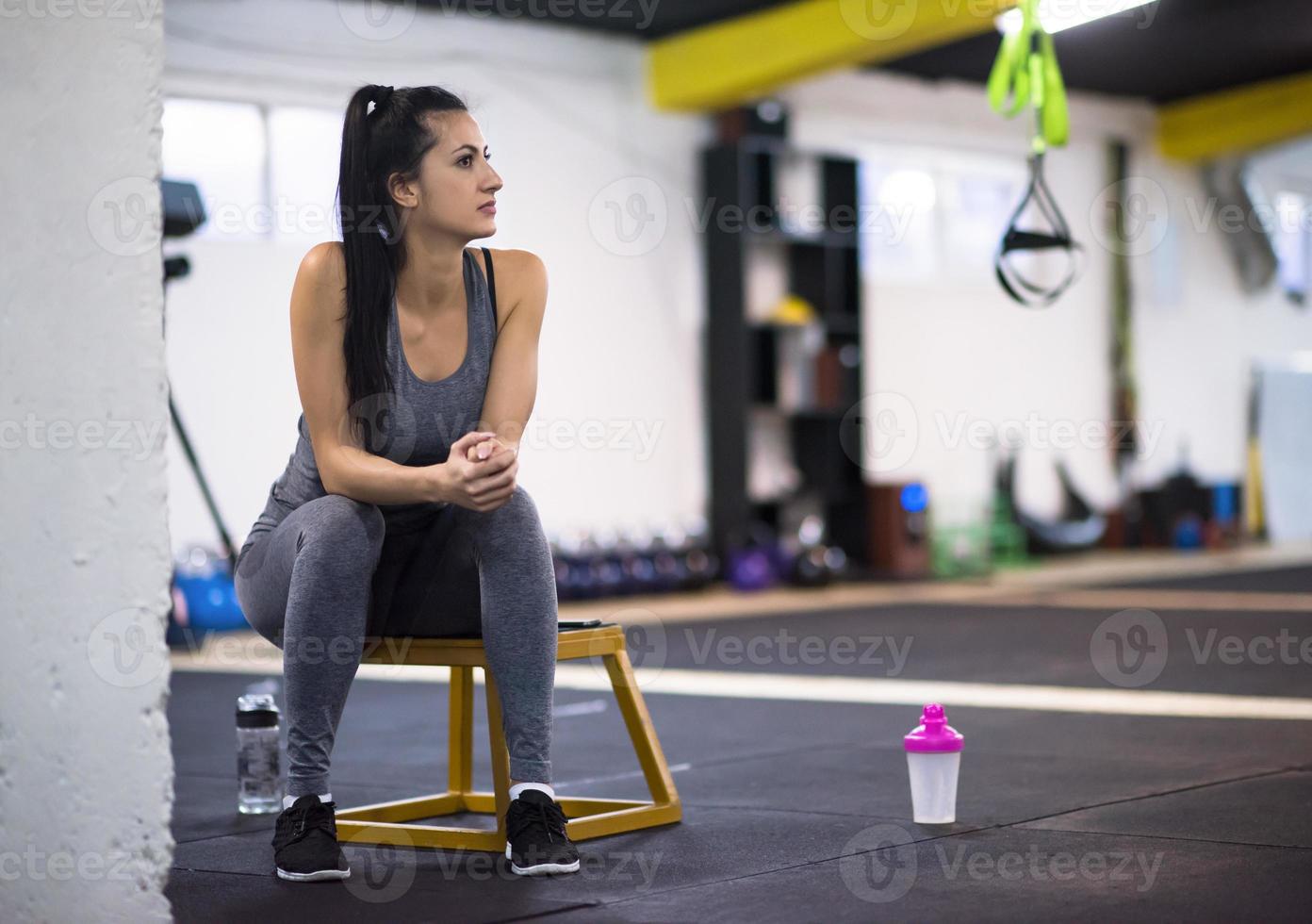 young athlete woman sitting and relaxing photo