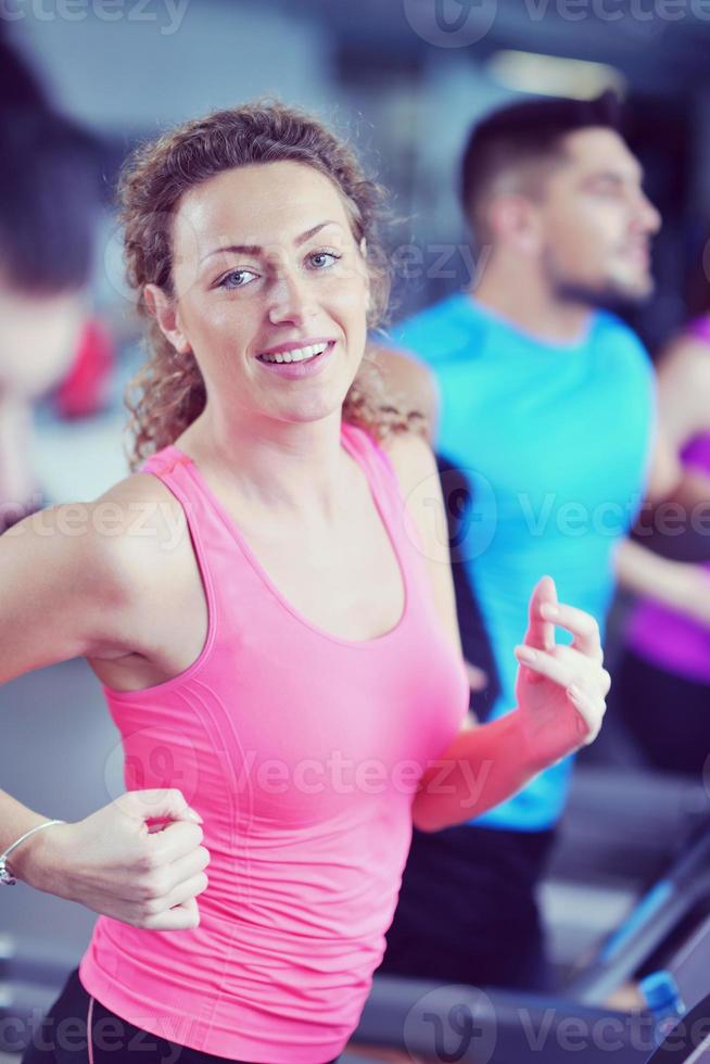 woman exercising on treadmill in gym photo