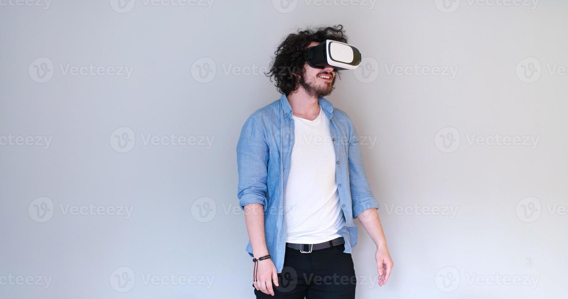 Man using headset of virtual reality photo