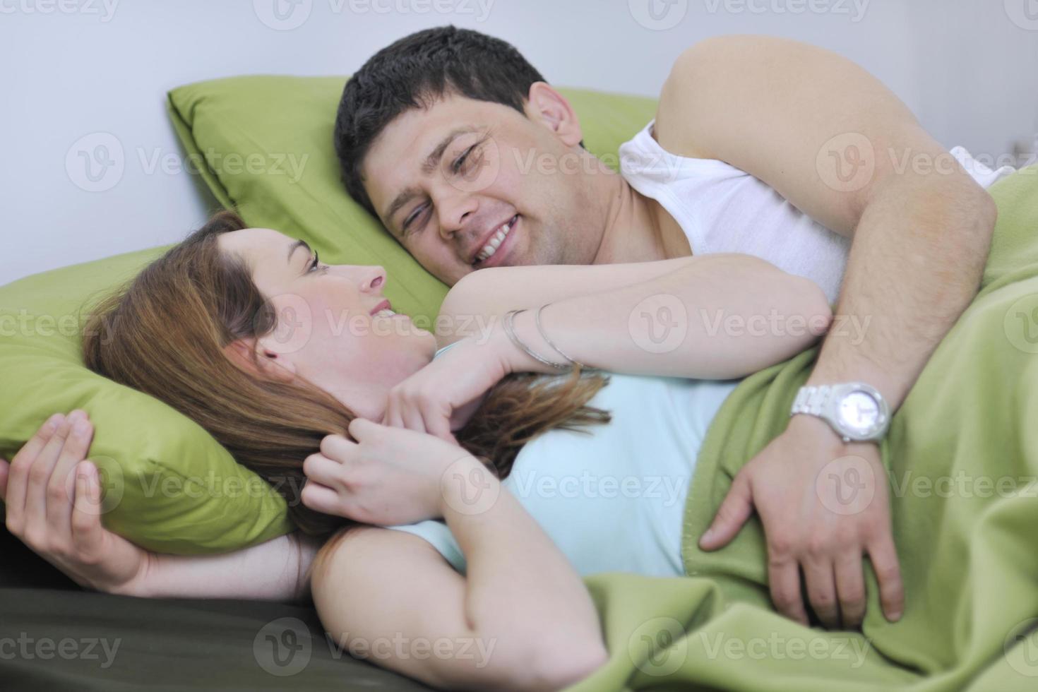 young couple in bed photo