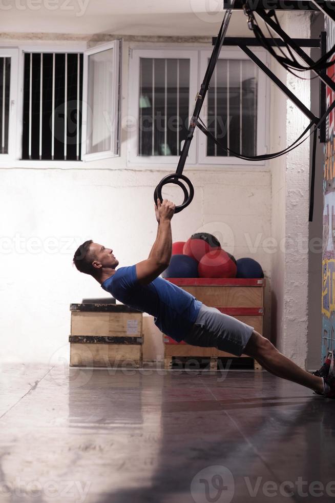 man doing dipping exercise photo