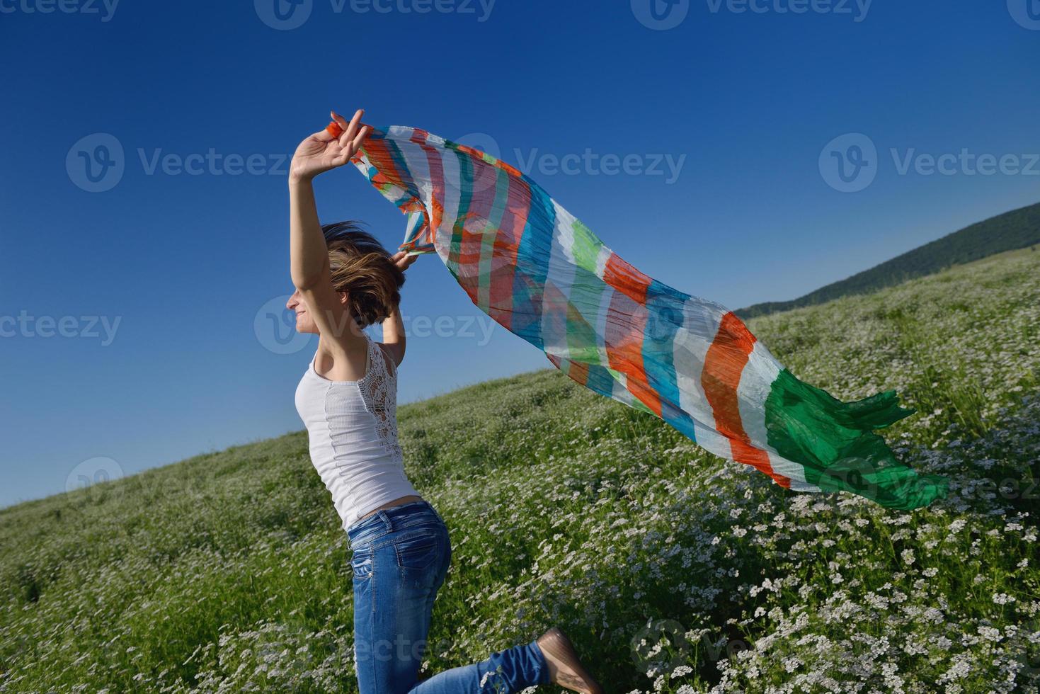 young woman in wheat field at summer photo