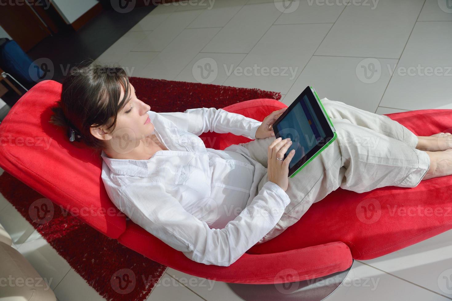 woman using tablet pc at home photo