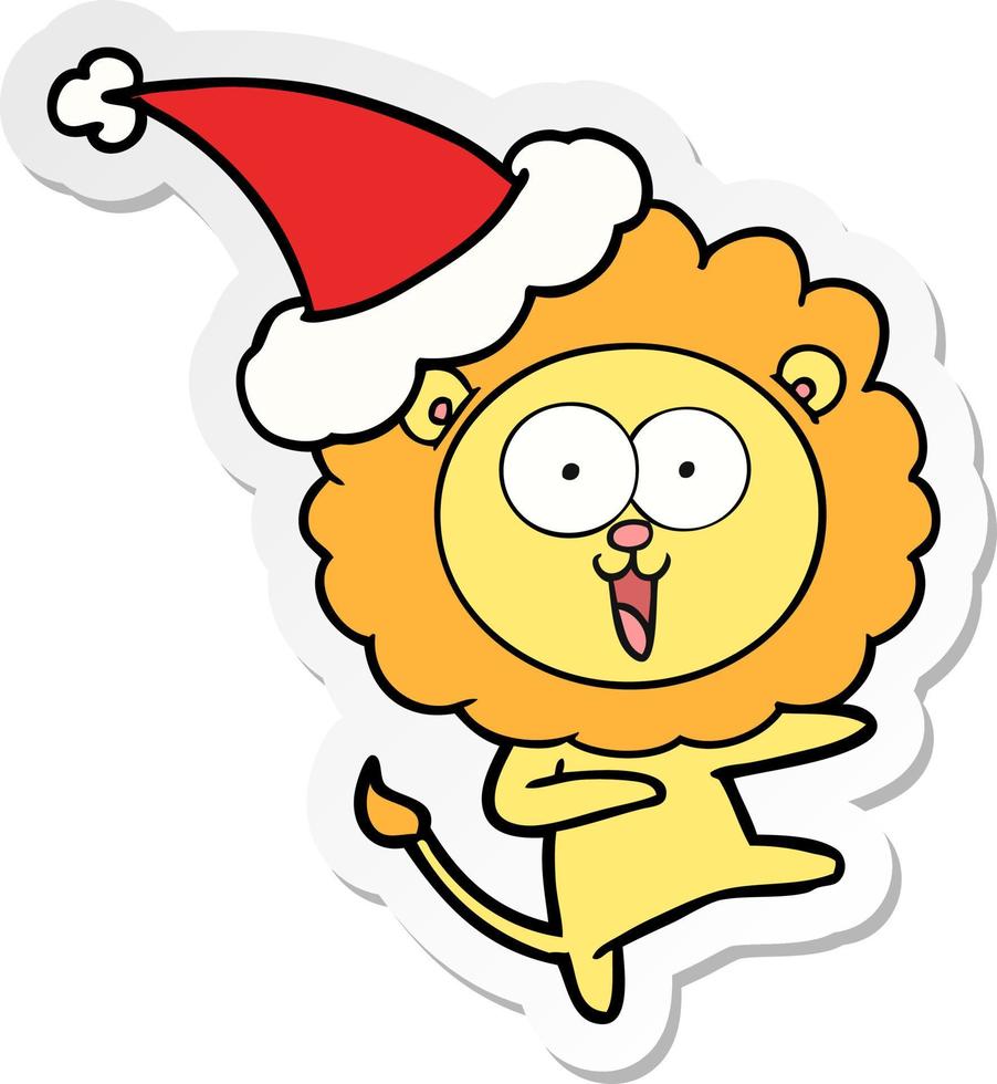 pegatina feliz caricatura de un león con gorro de Papá Noel vector