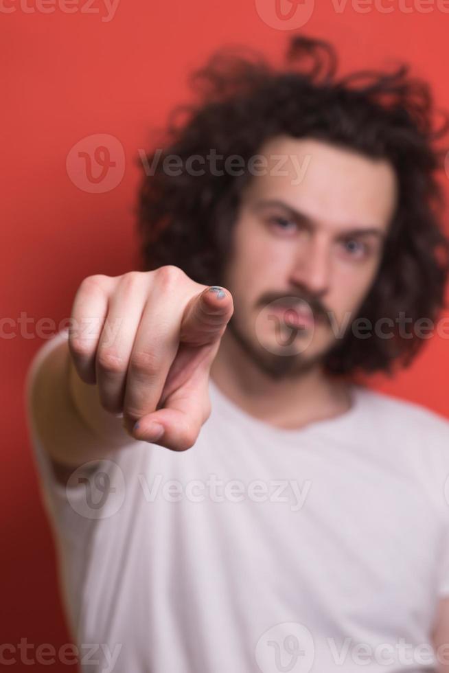 young man with funny hair over color background photo