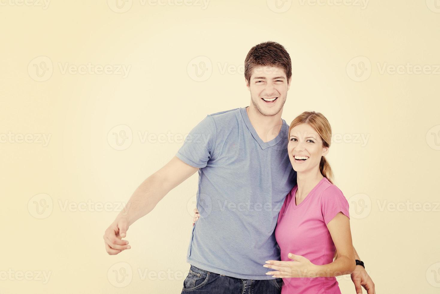 happy couple paint wall at new home photo
