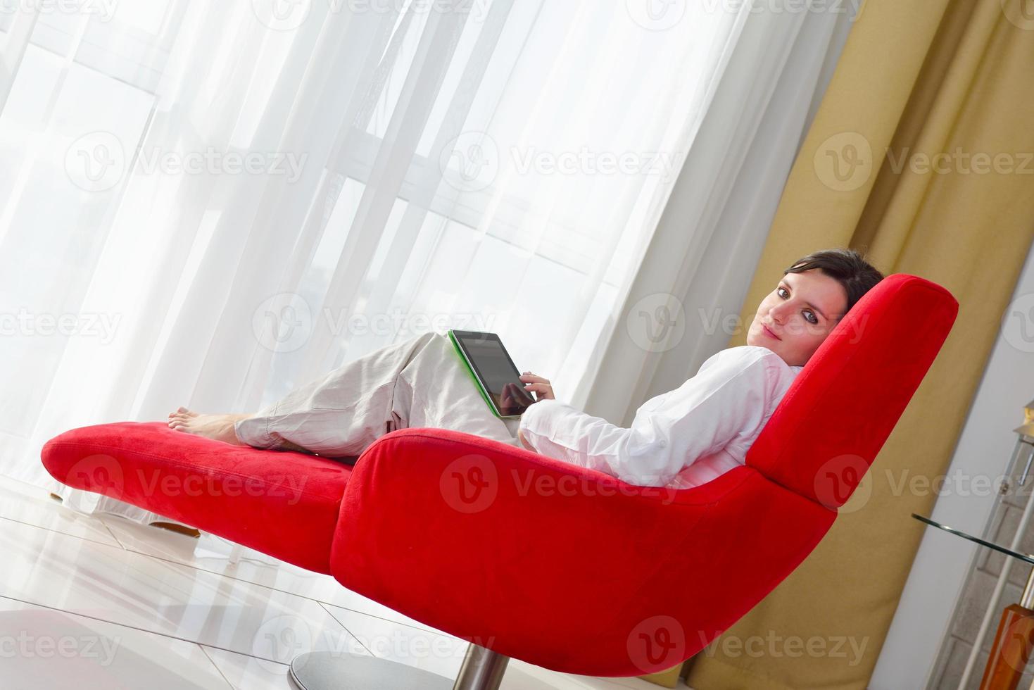 woman using tablet pc at home photo