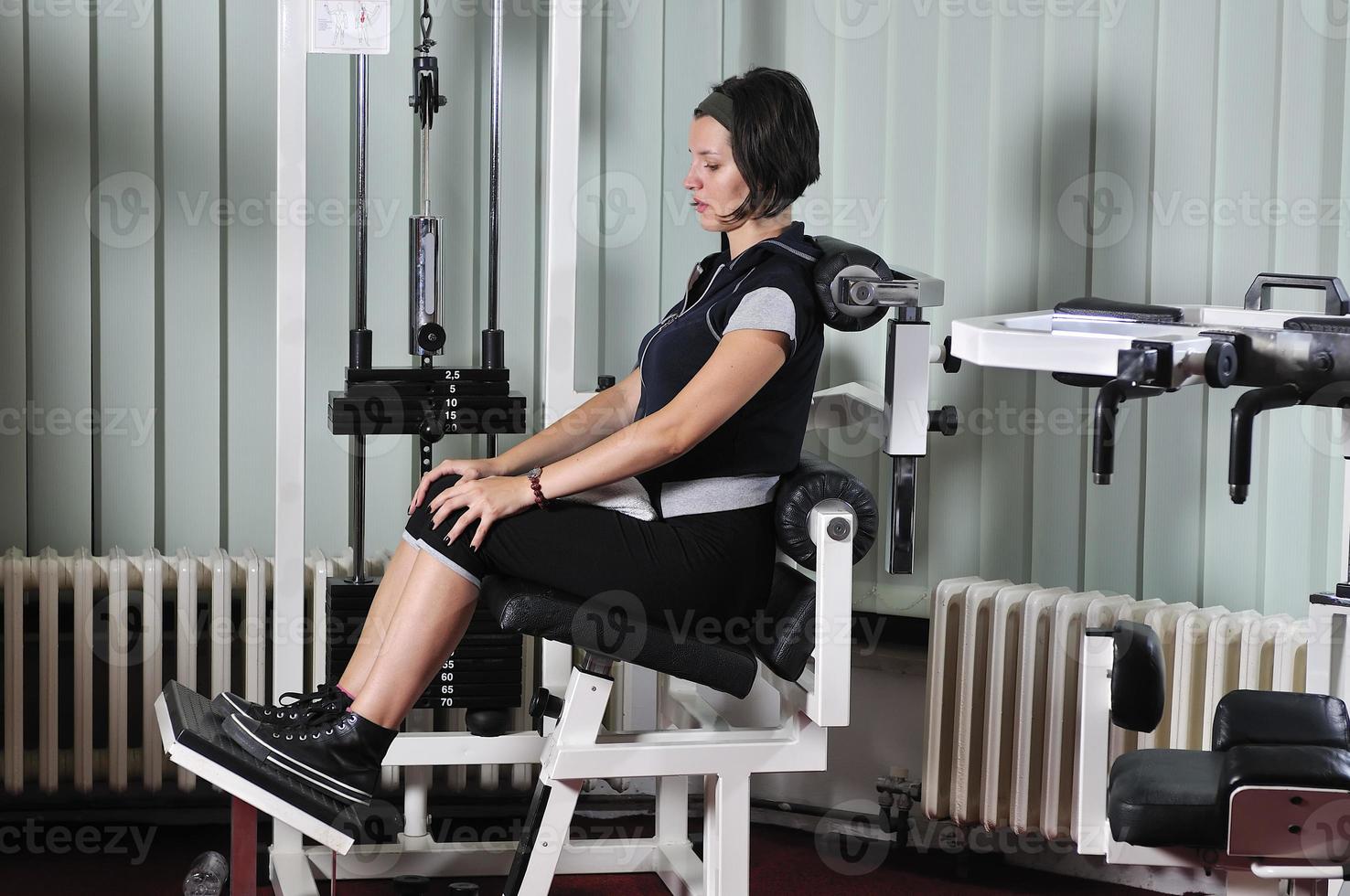 young  woman work out in fitness photo