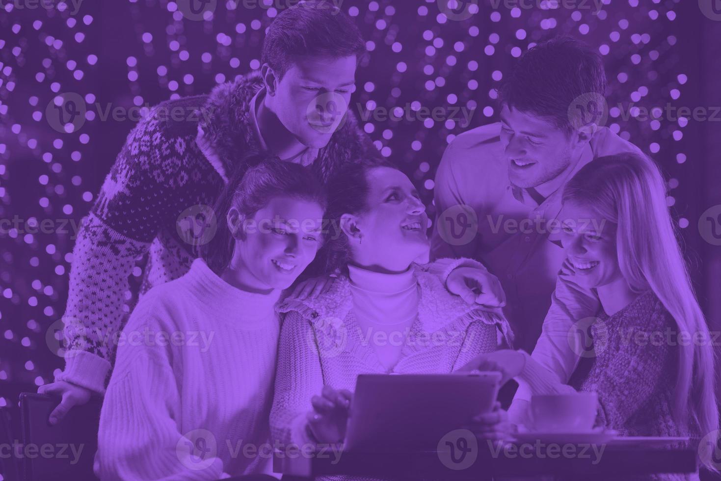 happy people looking at a tablet computer photo