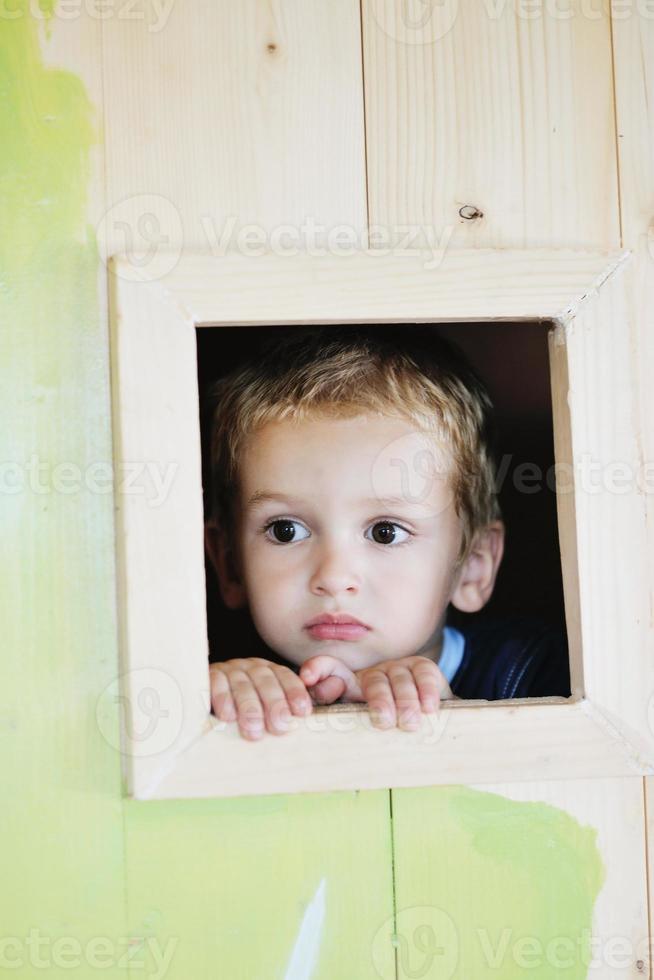 happy child in a window photo