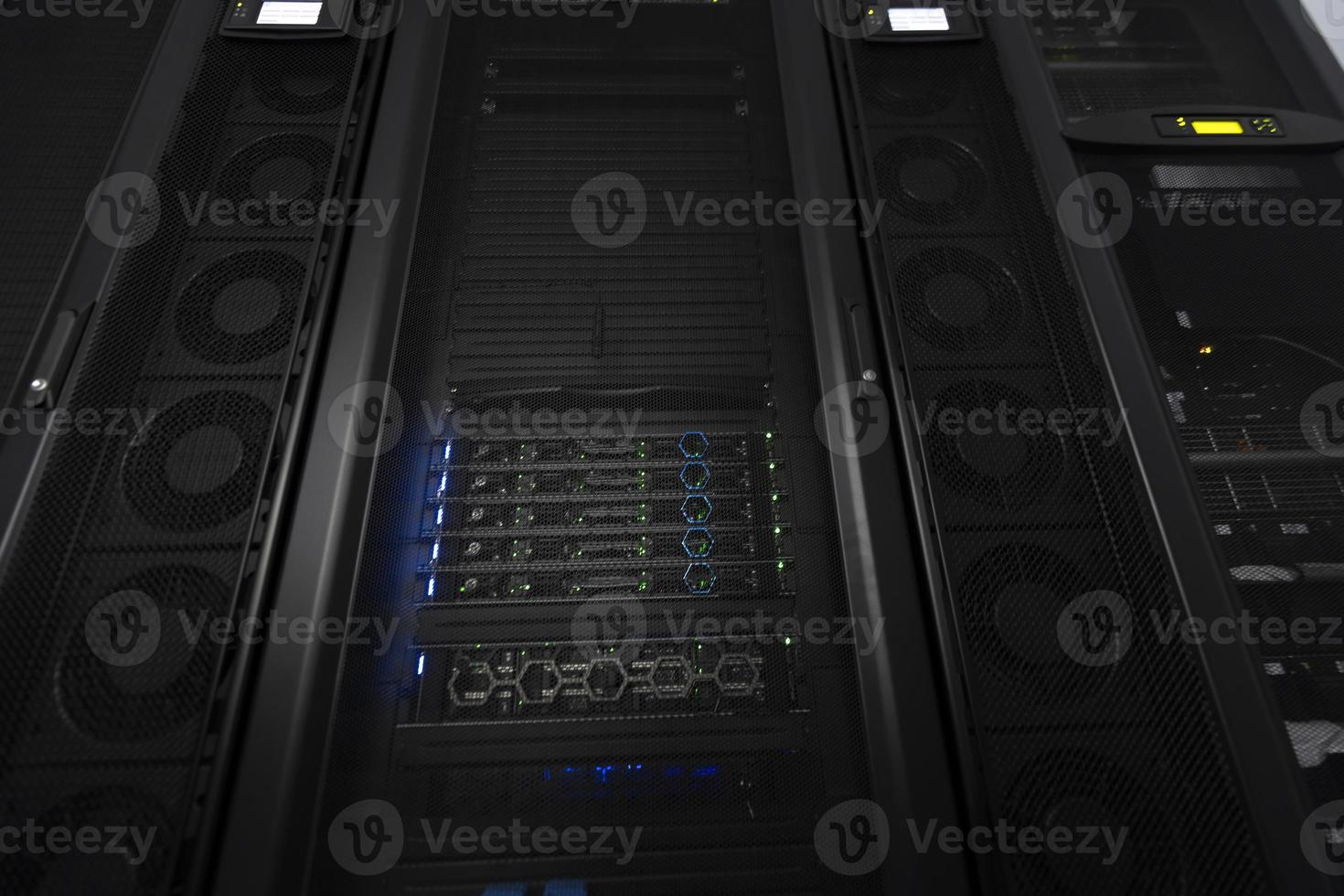 Data Center With Multiple Rows of Fully Operational Server Racks. Modern Telecommunications, Cloud Computing, Artificial Intelligence, Database, Supercomputer Technology Concept. photo