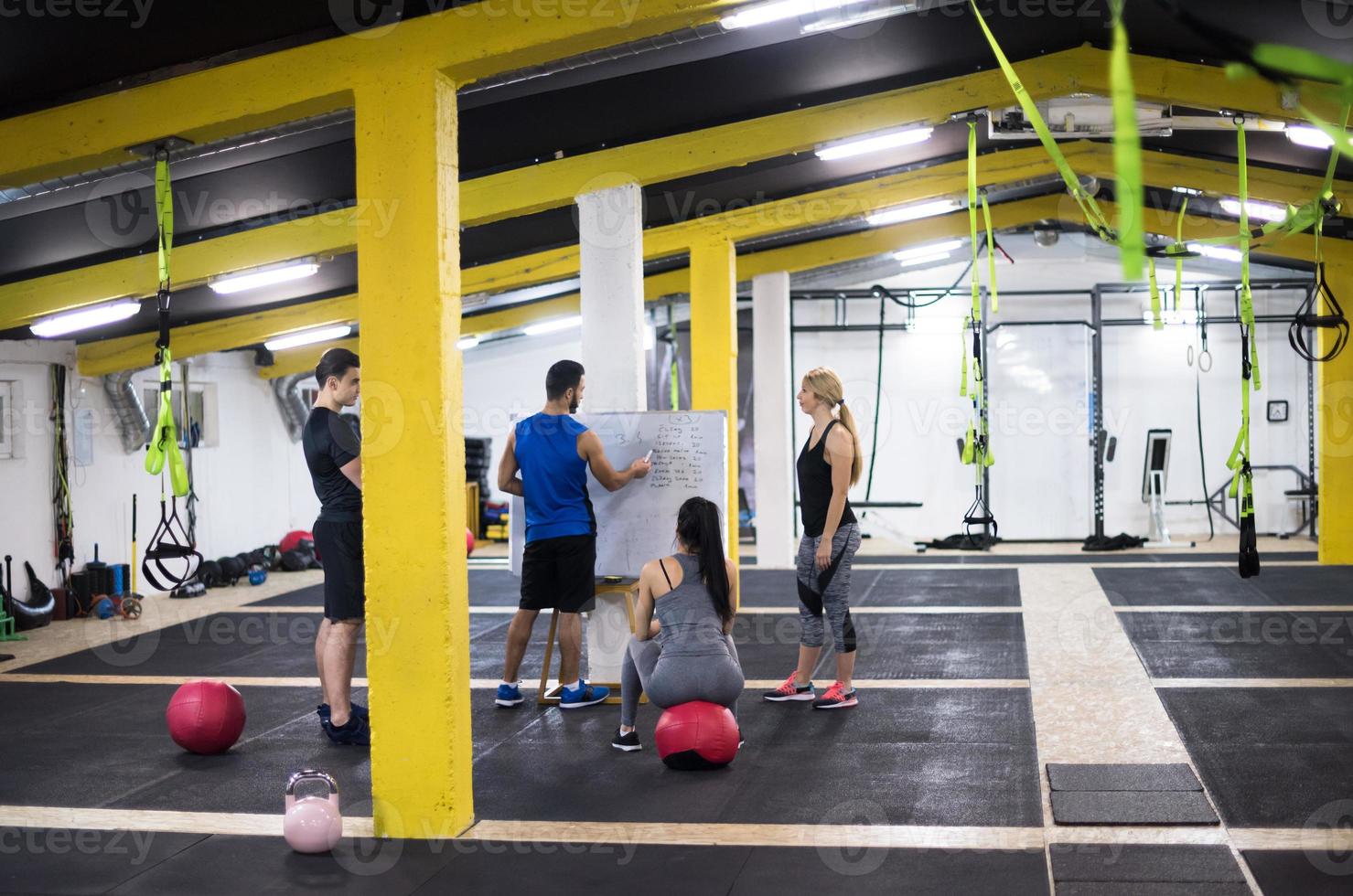 athletes getting instructions from trainer photo