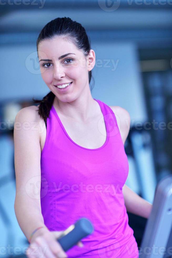 woman exercising on treadmill in gym photo