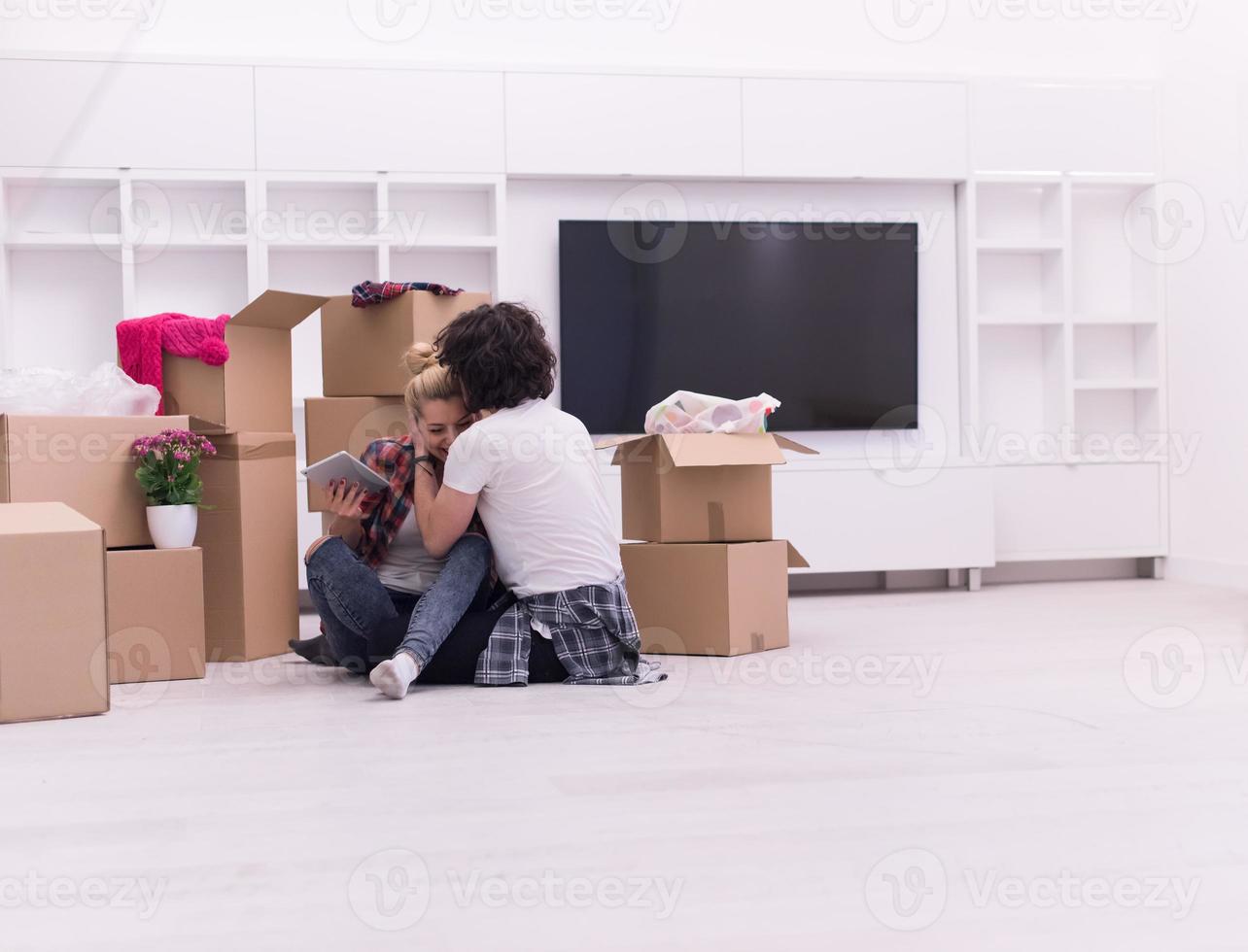 young couple moving  in new house photo