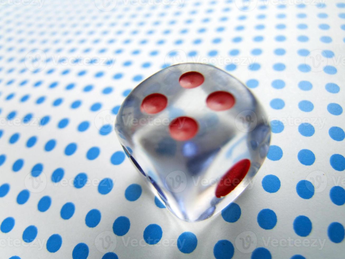 gamblig dice on blue dotted background photo