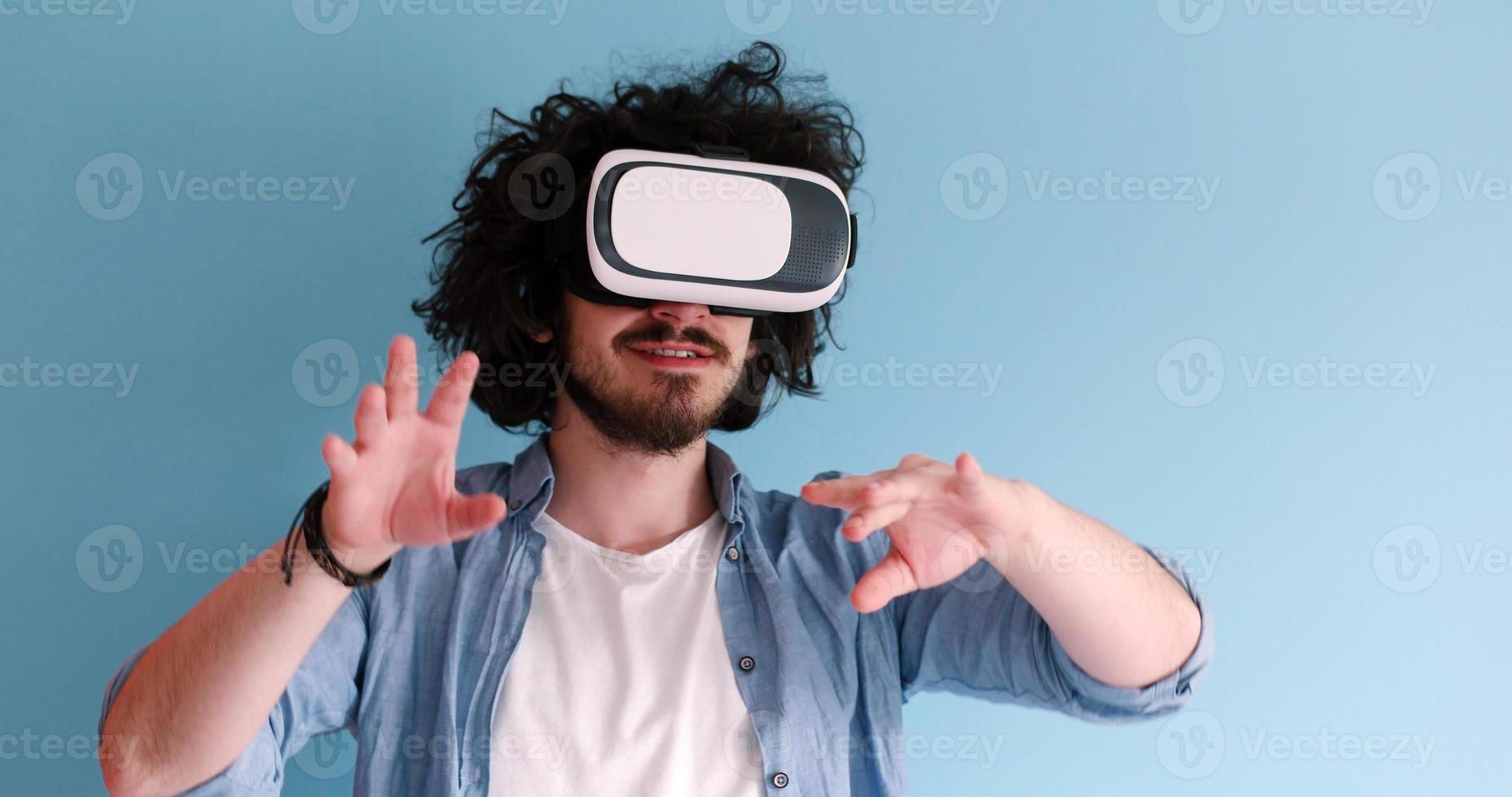 man using VR headset glasses of virtual reality photo