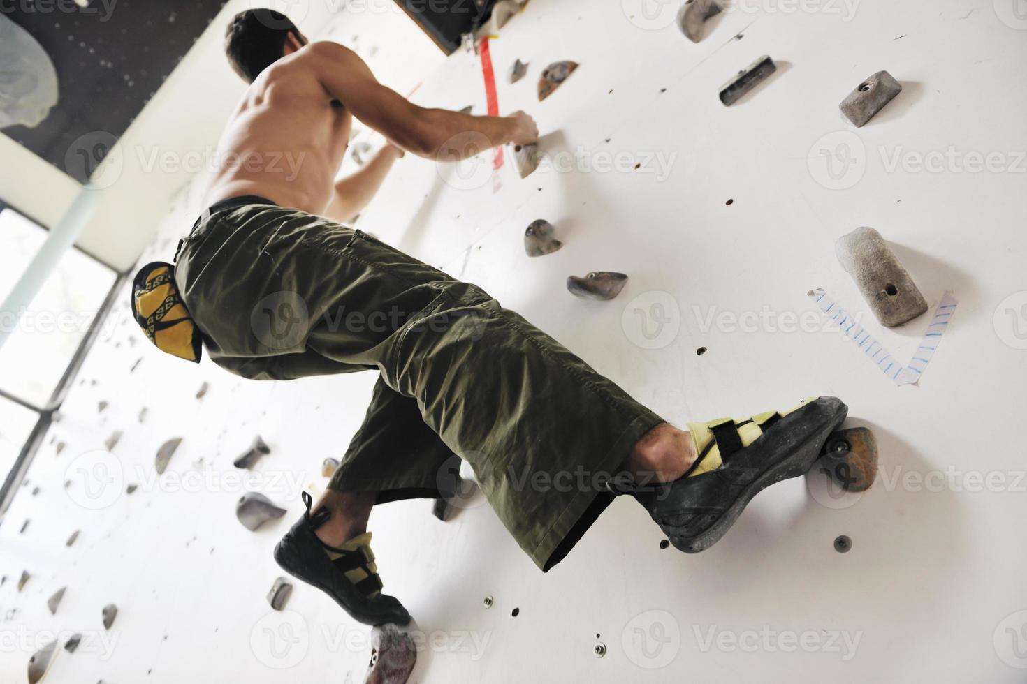 Man rock climbing photo