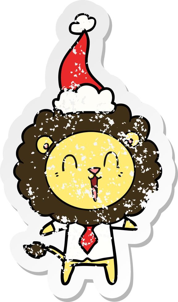 laughing lion distressed sticker cartoon of a wearing santa hat vector