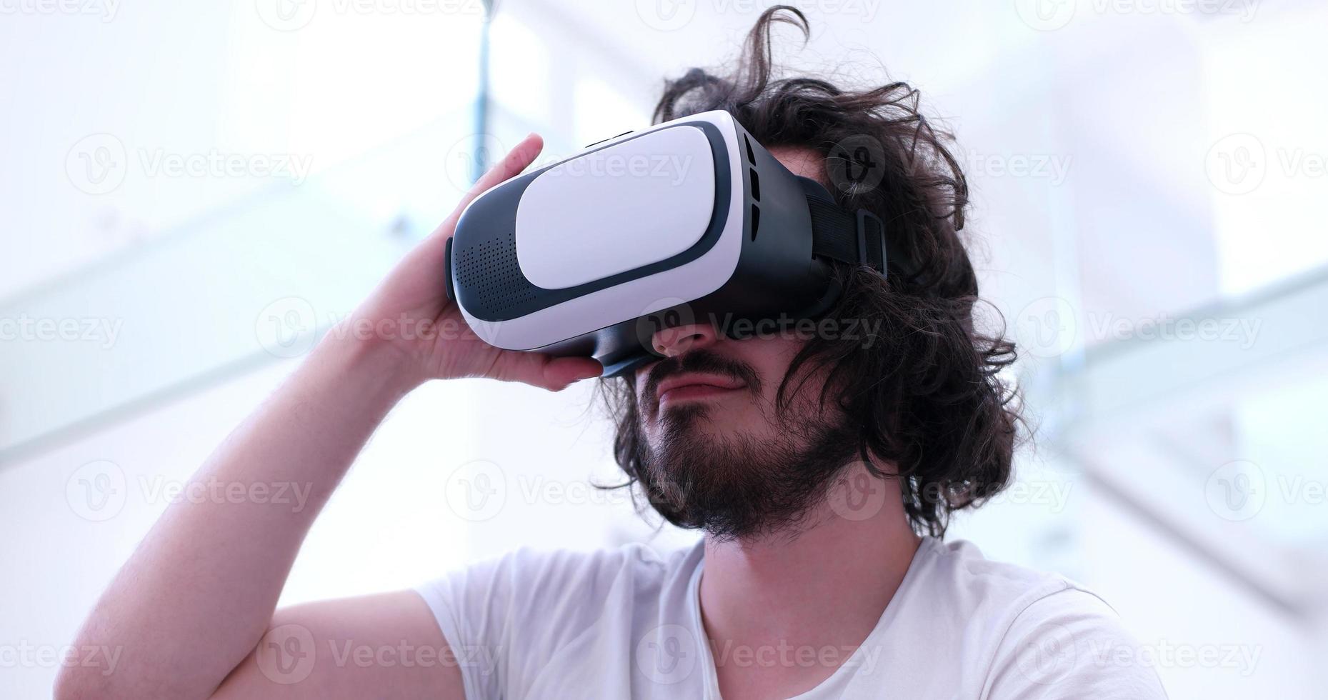 man using VR-headset glasses of virtual reality photo