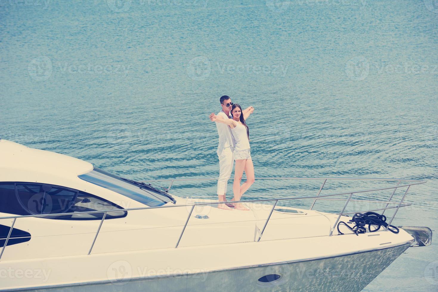 young couple on yacht photo