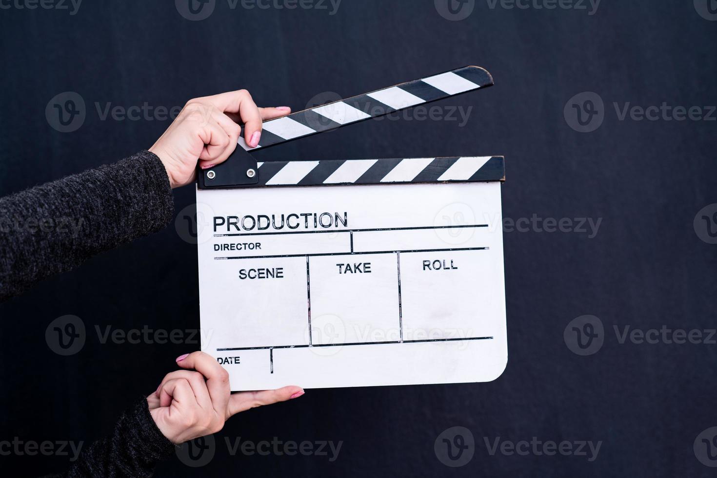 movie clapper on black chalkboard background photo