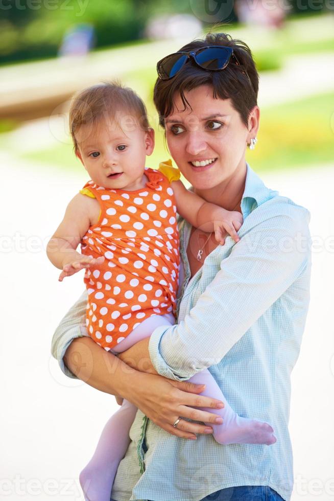 mother and baby in park photo