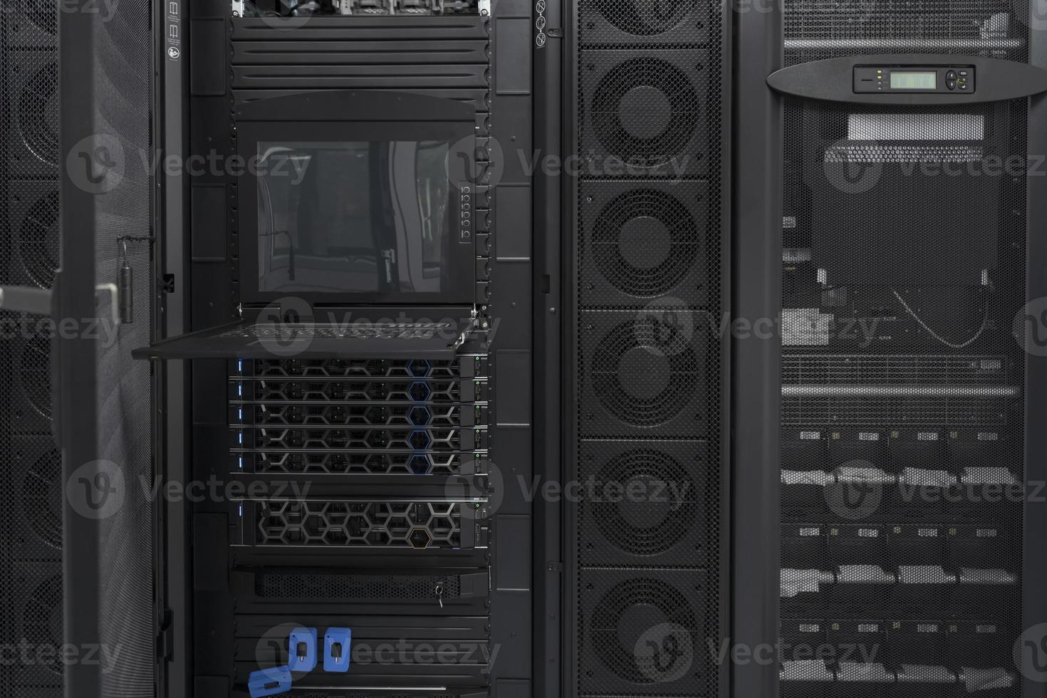 Data Center With Multiple Rows of Fully Operational Server Racks. Modern Telecommunications, Cloud Computing, Artificial Intelligence, Database, Supercomputer Technology Concept. photo