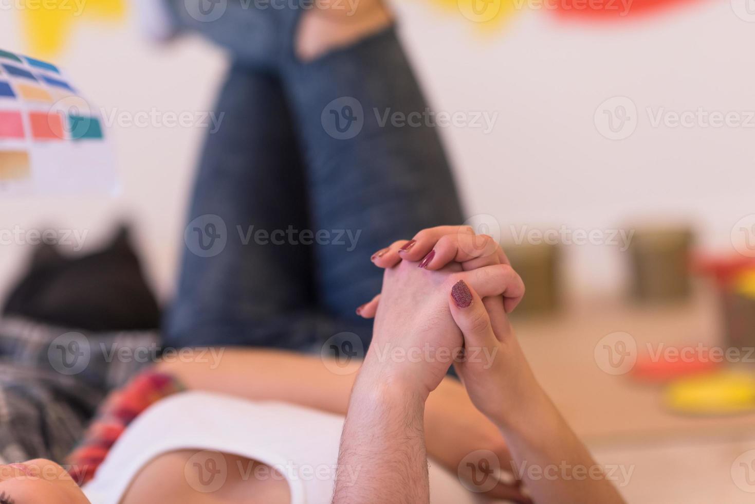 Happy young couple relaxing after painting photo