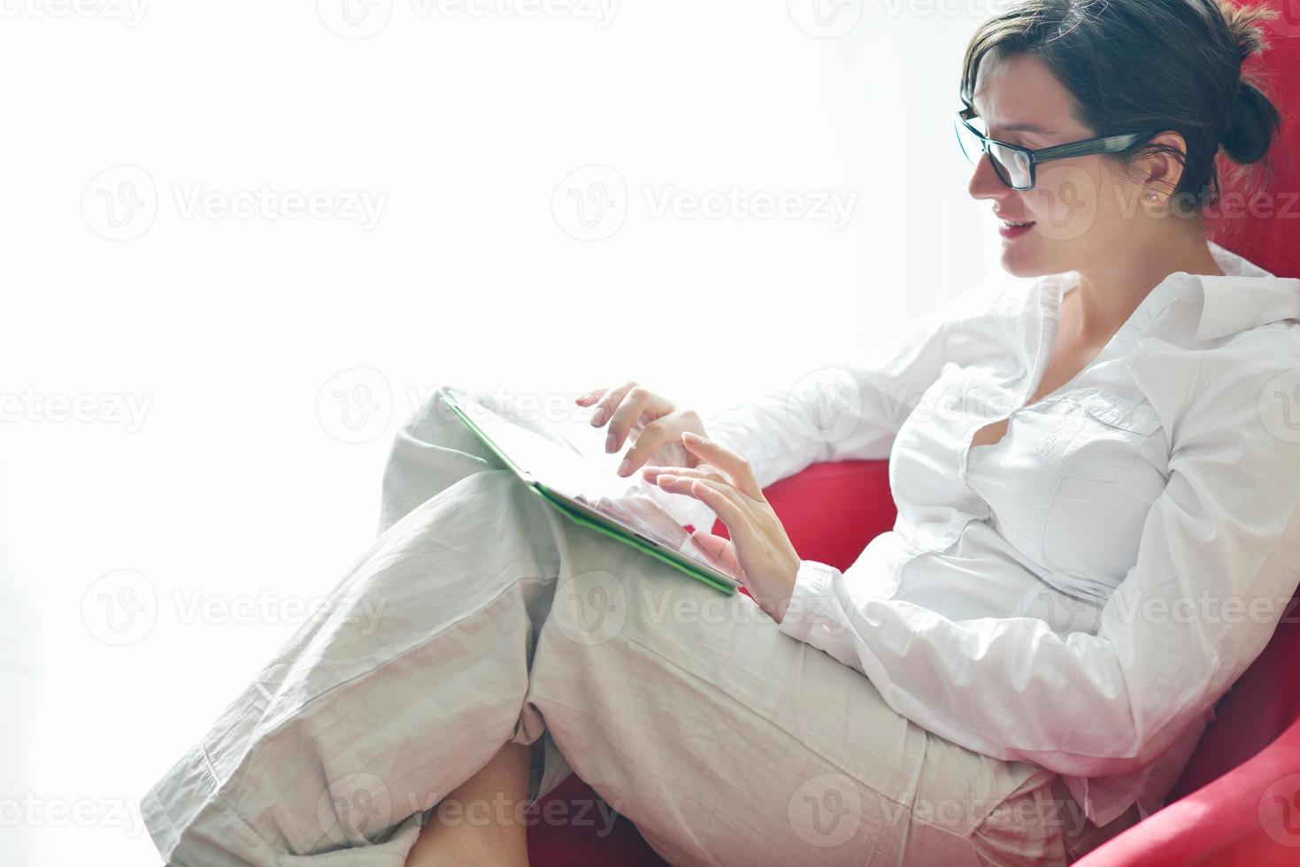 woman using tablet pc at home photo