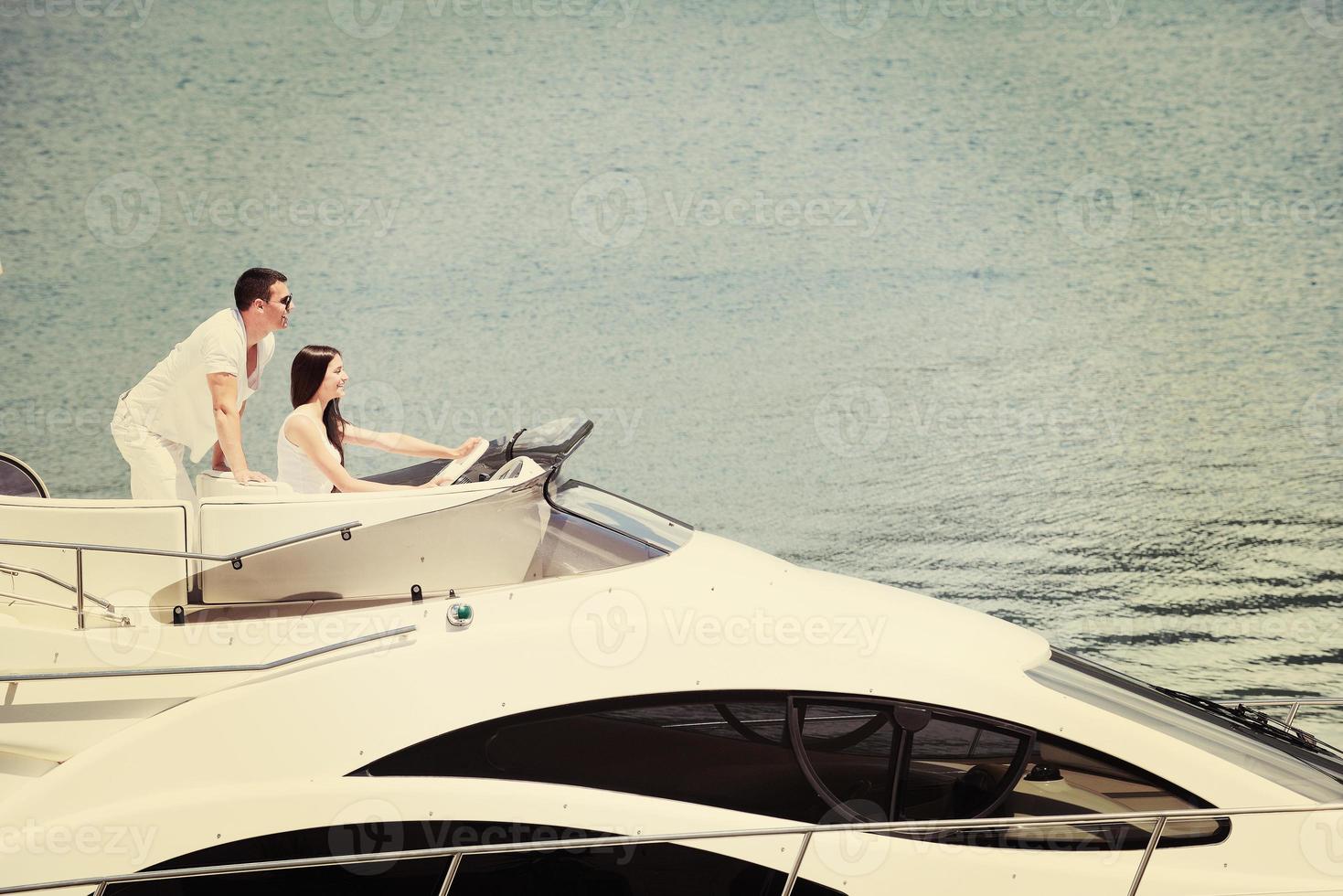 young couple on yacht photo