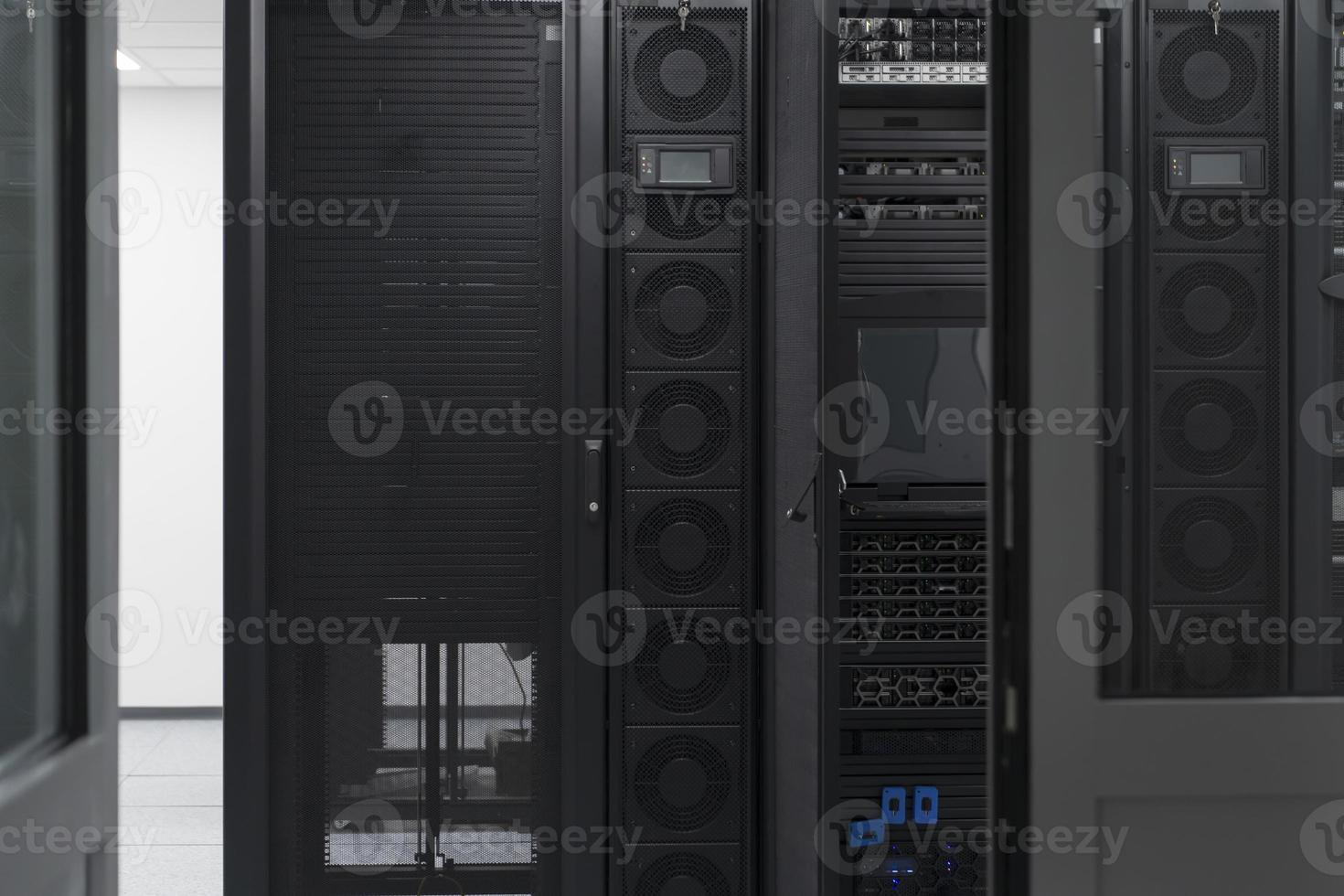 Data Center With Multiple Rows of Fully Operational Server Racks. Modern Telecommunications, Cloud Computing, Artificial Intelligence, Database, Supercomputer Technology Concept. photo