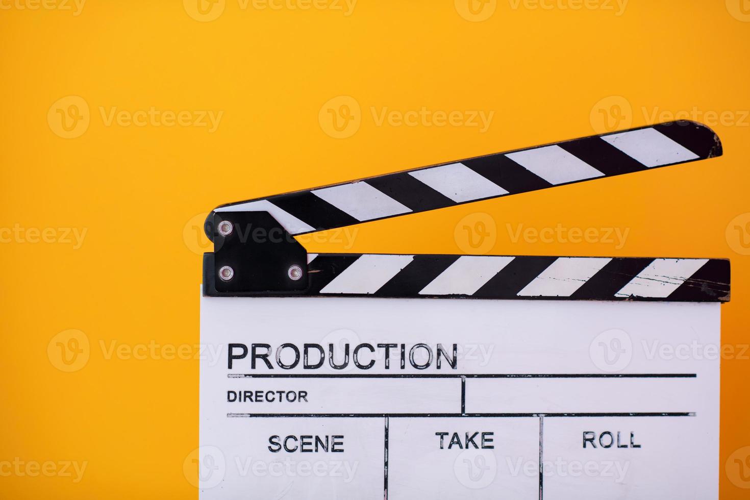 movie clapper on yellow background photo