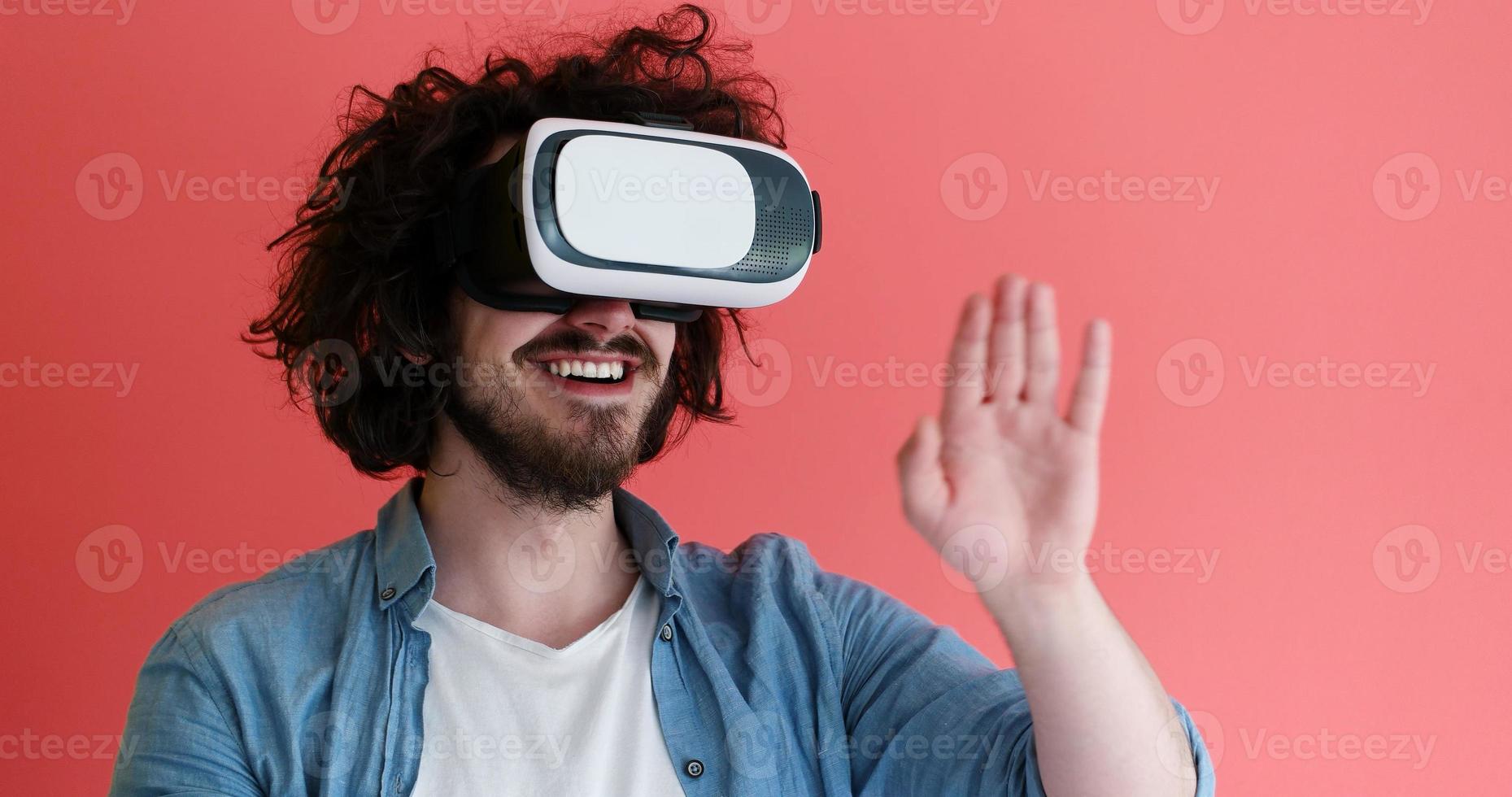 young man using VR headset glasses of virtual reality photo