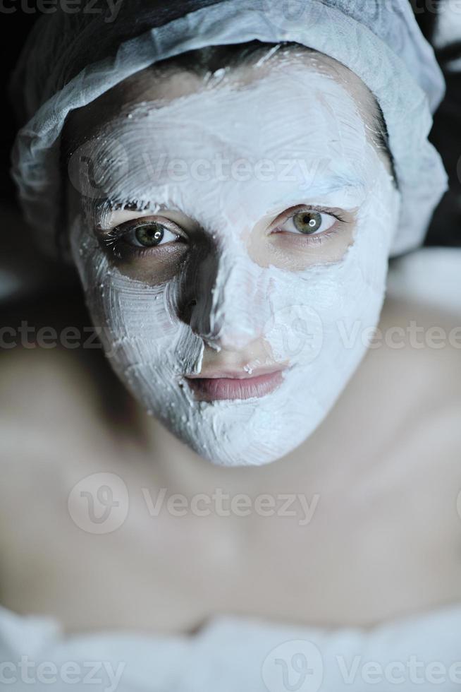 woman with facial mask in cosmetic studio photo