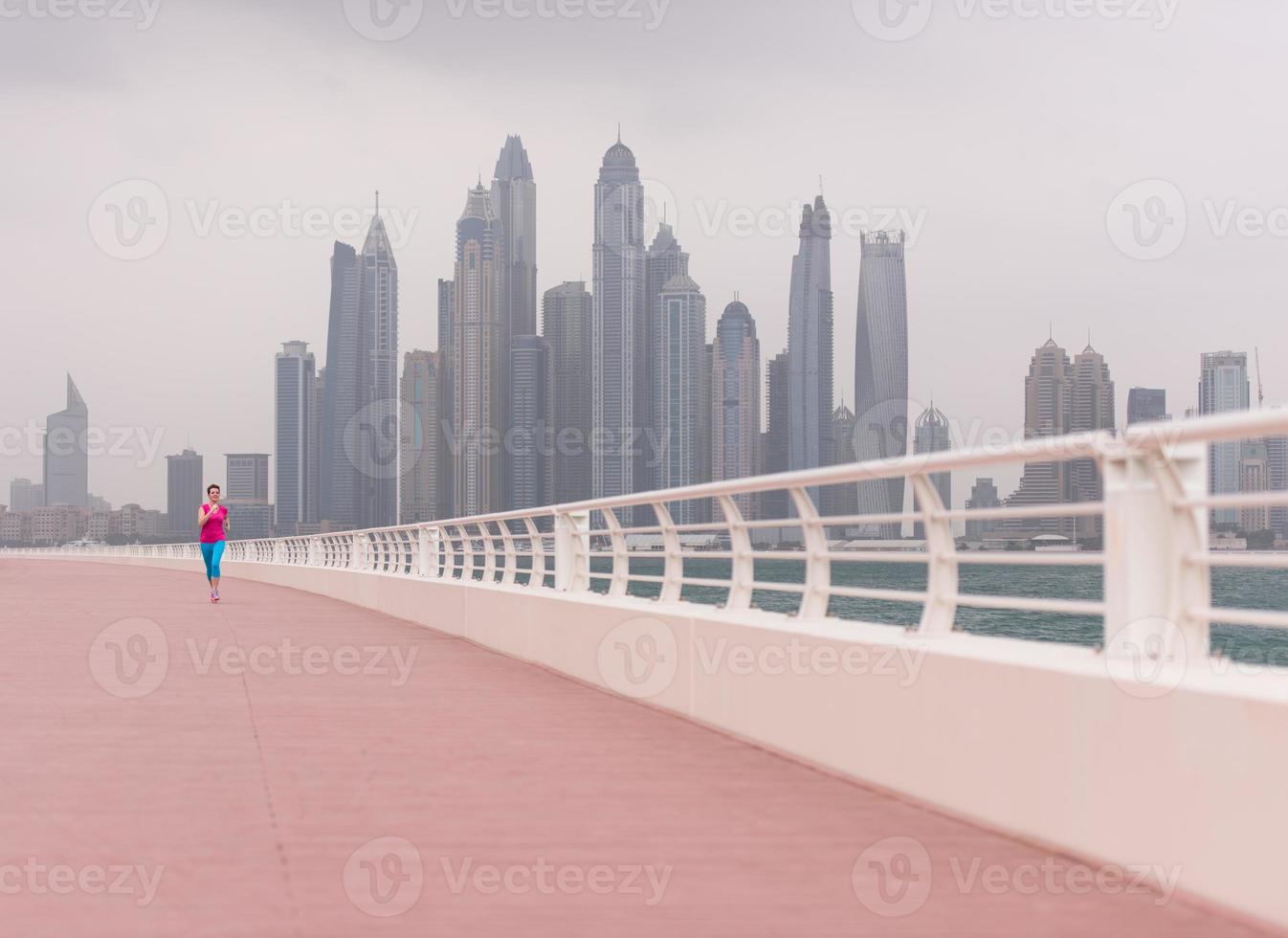 woman running on the promenade photo