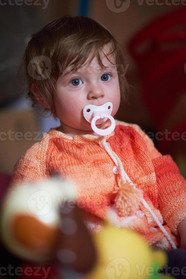 child playing with toys  at home photo